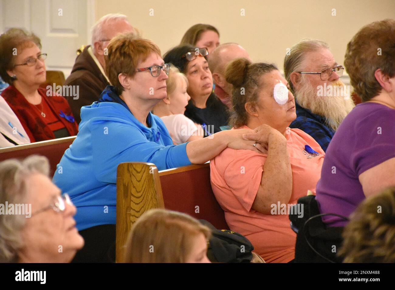 Becky Goza, left, and Virginia Newell comfort each other during the prayer vigil held for Arissa