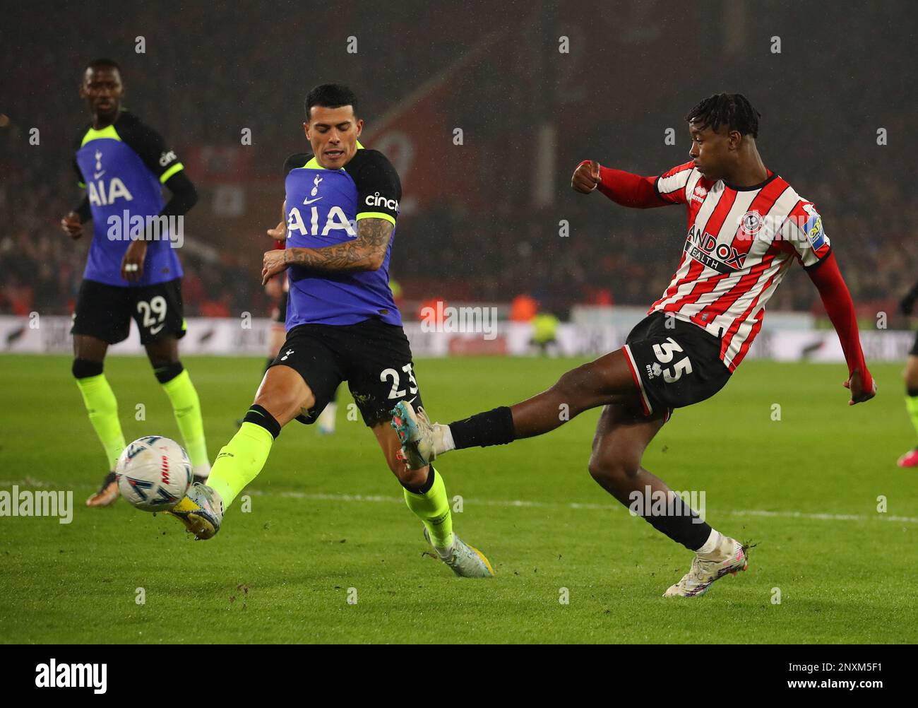 Sheffield United's Jack Robinson (right) tackles Tottenham Hotspur's Pedro  Porro during the Emirates FA Cup fifth round match at Bramall Lane,  Sheffield. Picture date: Wednesday March 1, 2023 Stock Photo - Alamy