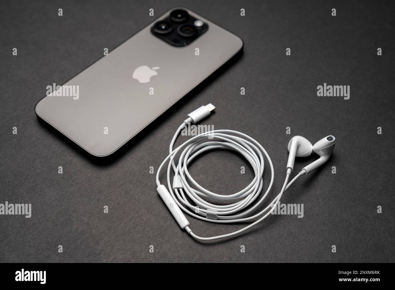 Apple iPhone 14 Pro Max, Space Black, smartphone back view. Next to it are  the new Apple Earpods, Airpods headphones for listening to music Stock  Photo - Alamy