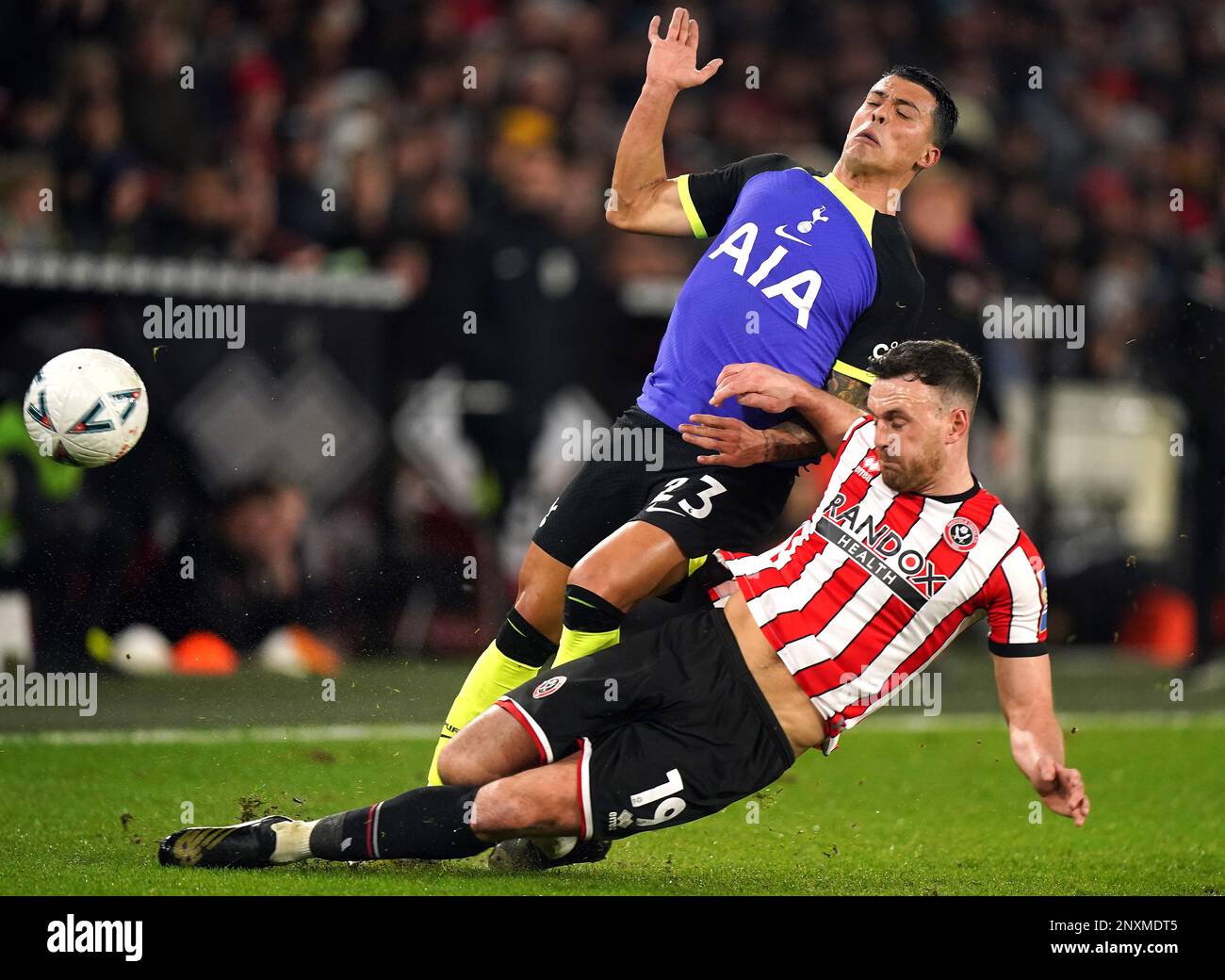 Sheffield United's Jack Robinson (right) tackles Tottenham Hotspur's Pedro  Porro during the Emirates FA Cup fifth round match at Bramall Lane,  Sheffield. Picture date: Wednesday March 1, 2023 Stock Photo - Alamy