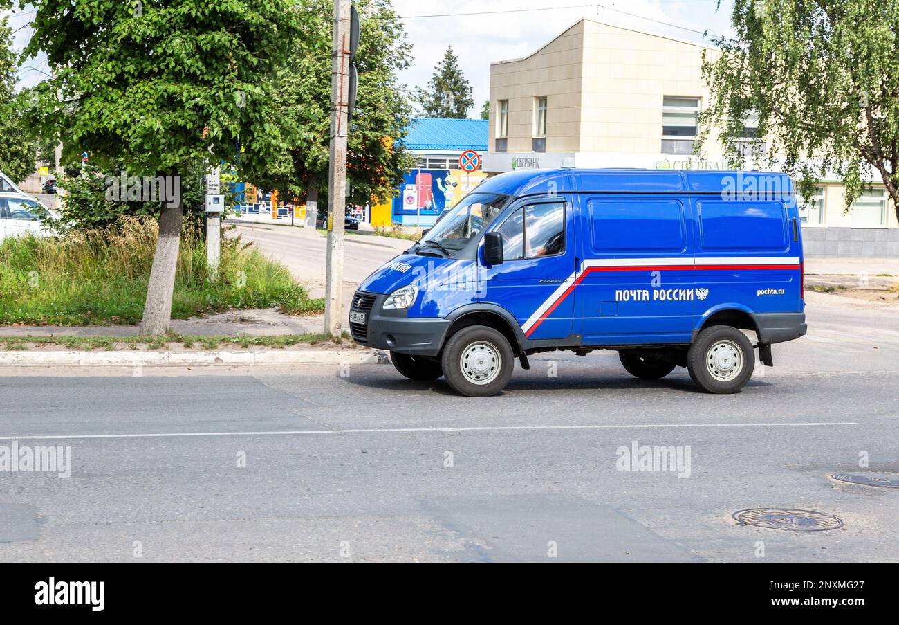 Valdai, Russia - August 6, 2022: Russian postal car rides along the city street. Russian Post minibus delivery, mail delivery truck Stock Photo