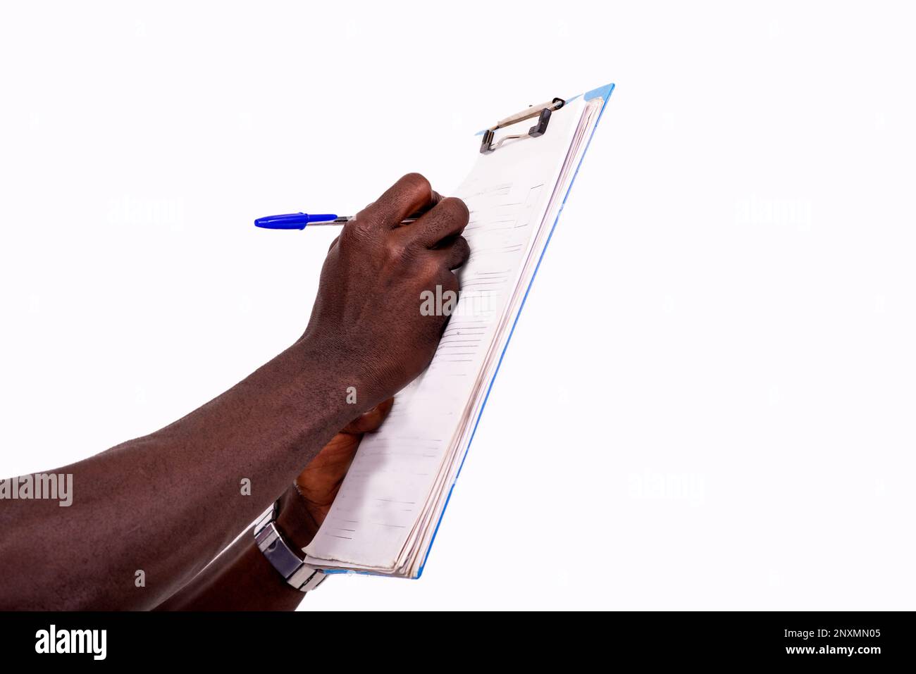 portrait of hands of a young man writing on clipboard Stock Photo - Alamy
