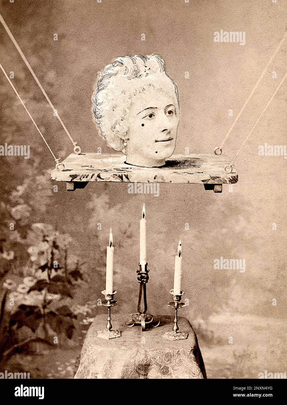 Photographic collage showing Jehanne d'Alcy as she appeared (as a magically suspended head) in Georges Melies's stage illusion La Source enchantee (1892) at the Theatre Robert-Houdin in Paris, 1892. Stock Photo