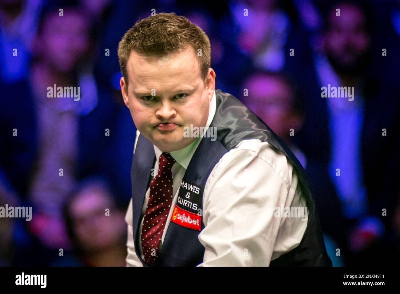 Shaun Murphy of England considers Judd Trump of England in their
