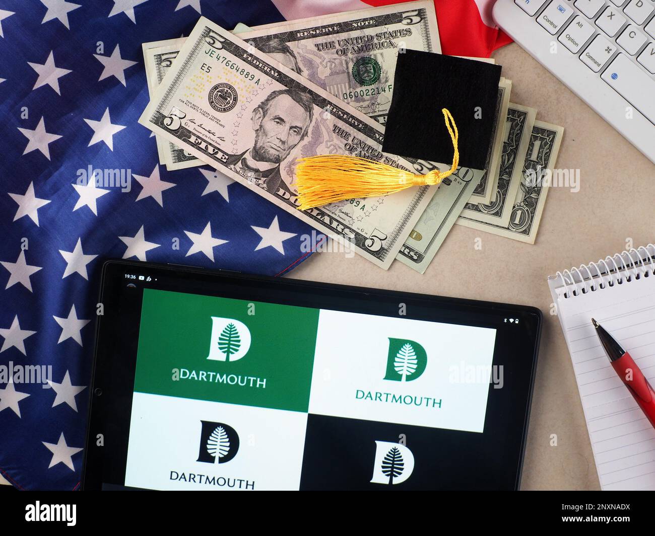 In this photo illustration, Dartmouth College  logo seen displayed on a tablet. Stock Photo