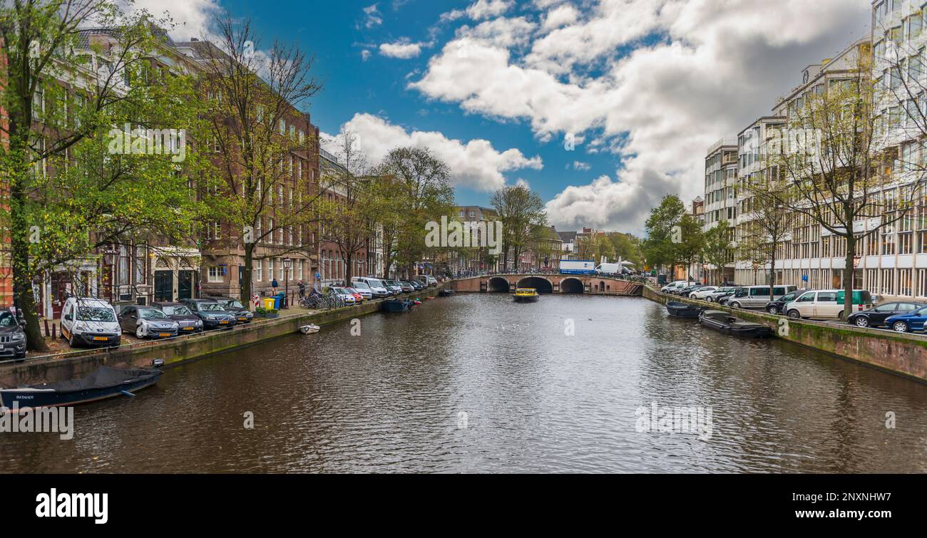 Panoramic of a typical canal in Amsterdam in Holland in the Netherlands Stock Photo