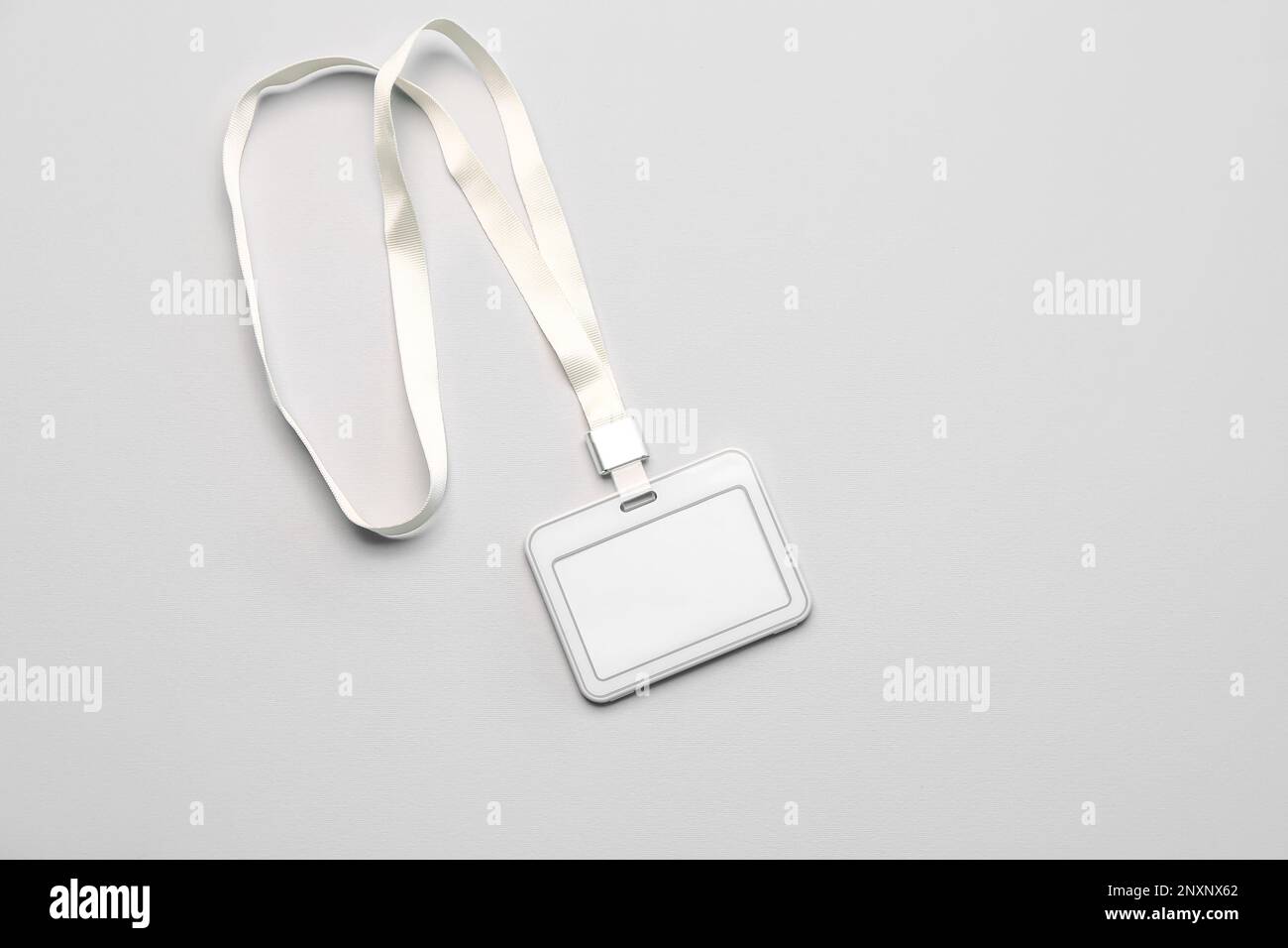 Blank badge with lanyard on light background Stock Photo - Alamy