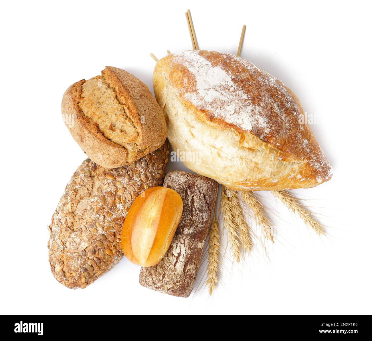 Loaves of different bread and wheat ears isolated on white background ...