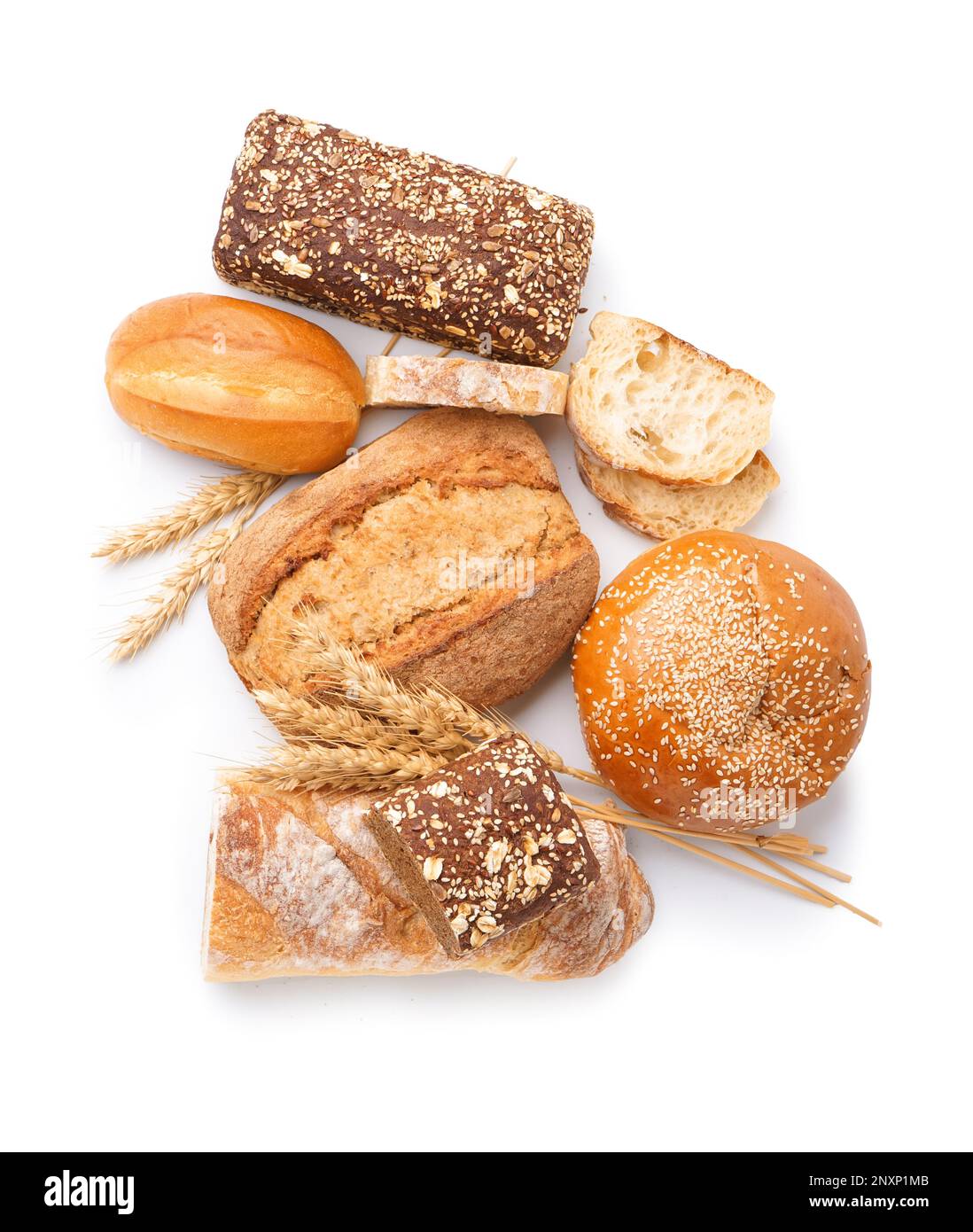 Loaves of different bread and wheat ears isolated on white background ...