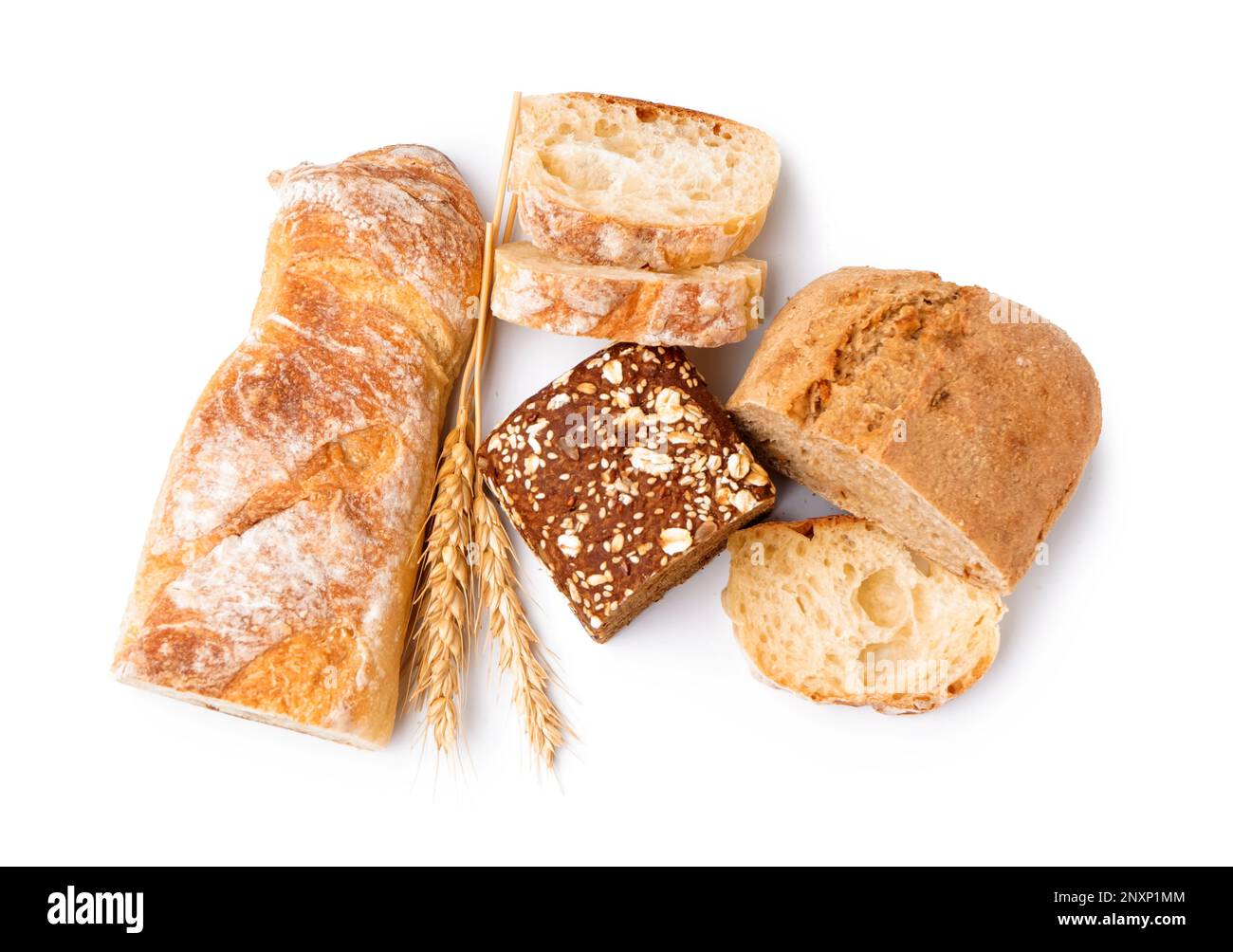 Loaves of different bread and wheat ears isolated on white background ...