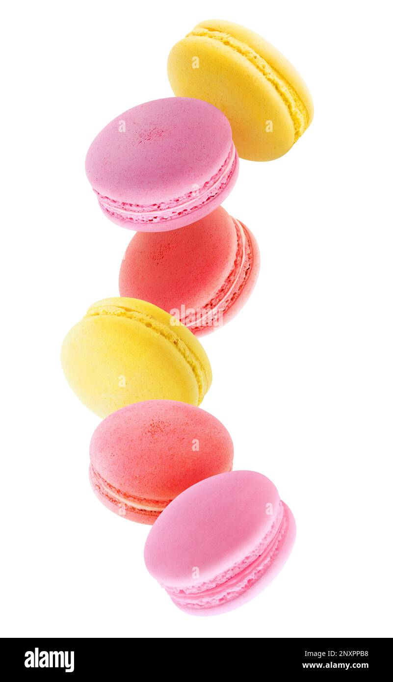 Red, pink and yellow macaroons levitating isolated on white background Stock Photo