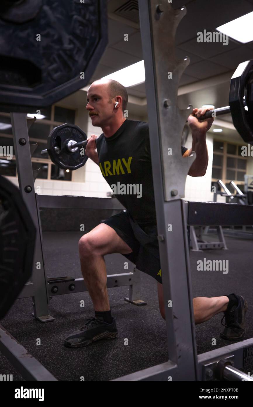 A Soldier assigned to the 1st Infantry Division performs barbell lunges