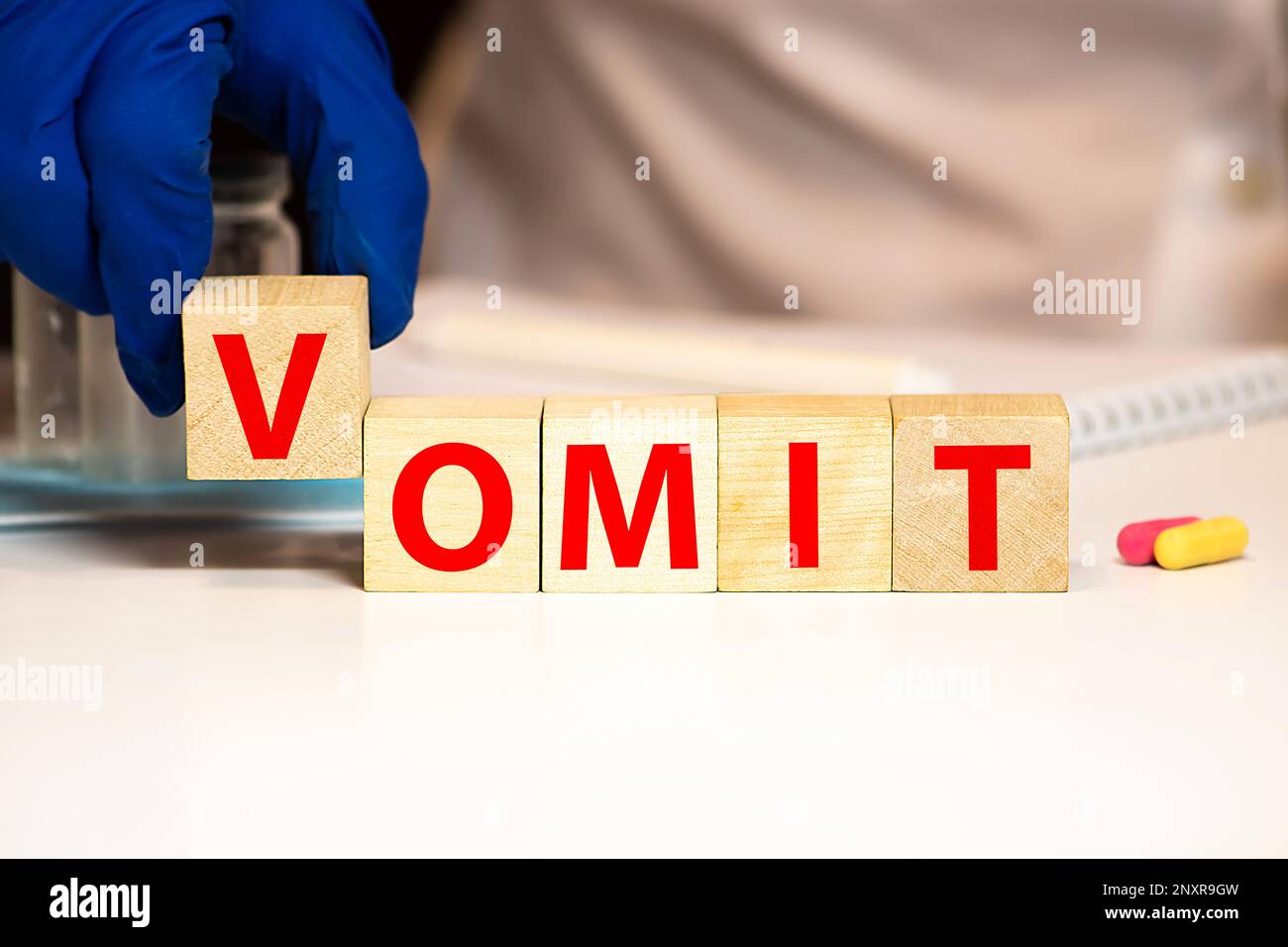 vomit word written on wood block. vomit text on wooden table for your