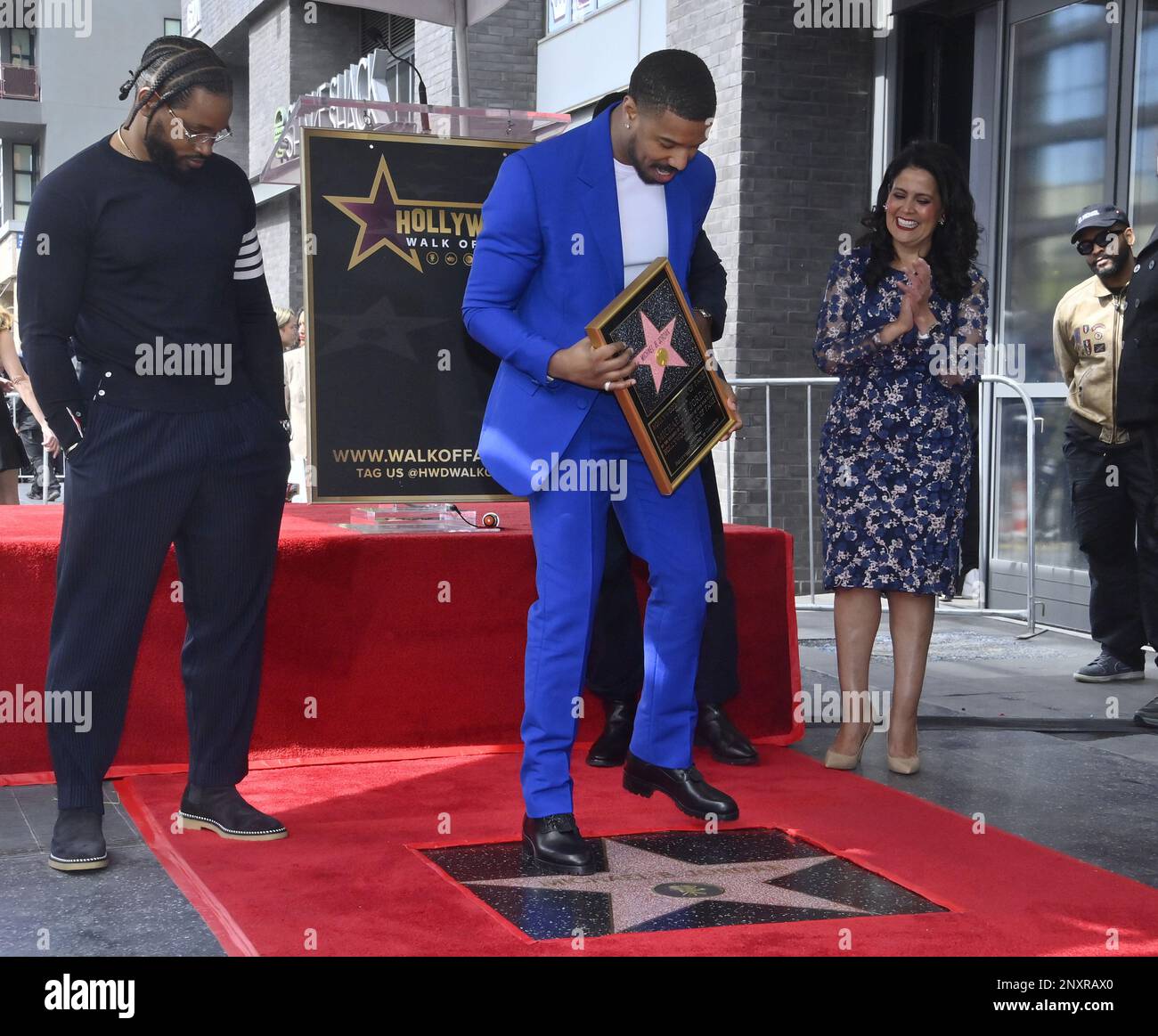 Los Angeles, United States. 01st Mar, 2023. Actor Michael B. Jordan steps on his star as director Ryan Coogler looks on after receiving the 2,751st star on the Hollywood Walk of Fame during an unveiling ceremony in Los Angeles on Wednesday, March 1, 2023. Photo by Jim Ruymen/UPI Credit: UPI/Alamy Live News Stock Photo