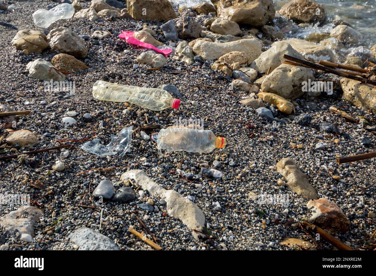 Heraklion, Crete Island, Greece. April 19, 2021: Poluted beach with plastic empty bottles Stock Photo