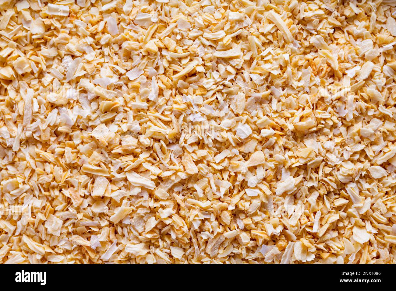 Heap of Dry Onion Flakes Background Close Up. Stock Photo