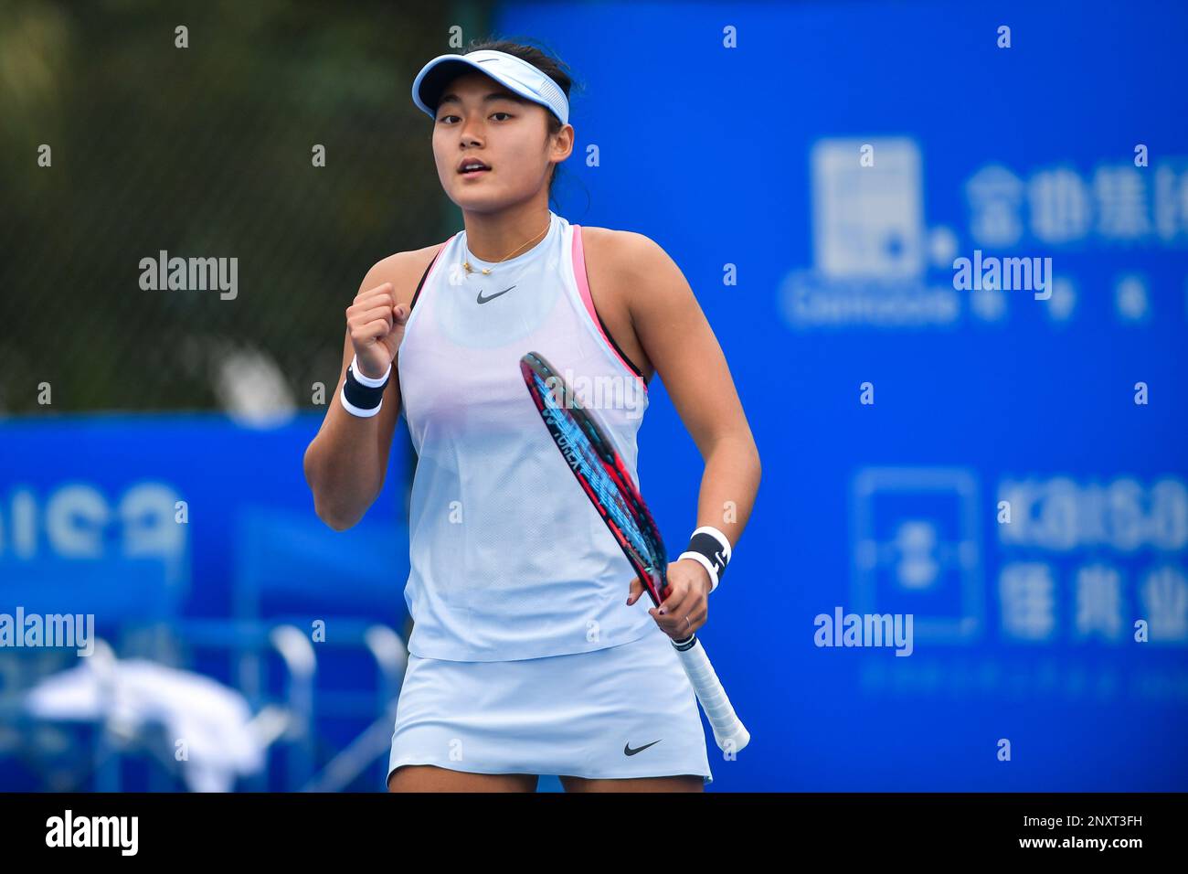 Wang Yafan of China poses to celebrate after scoring against Jasmine