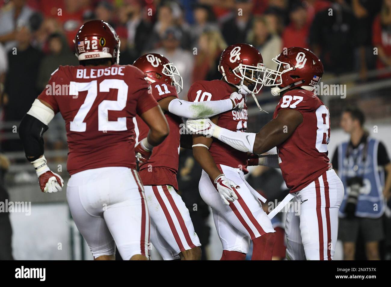 PASADENA, CA - JANUARY 01: DB Steven Parker (10) of the Oklahoma Sooners  celebrates with teammates after a 46 Yard Fumble Return a touchdown to put  the Sooners up 45-38 in the