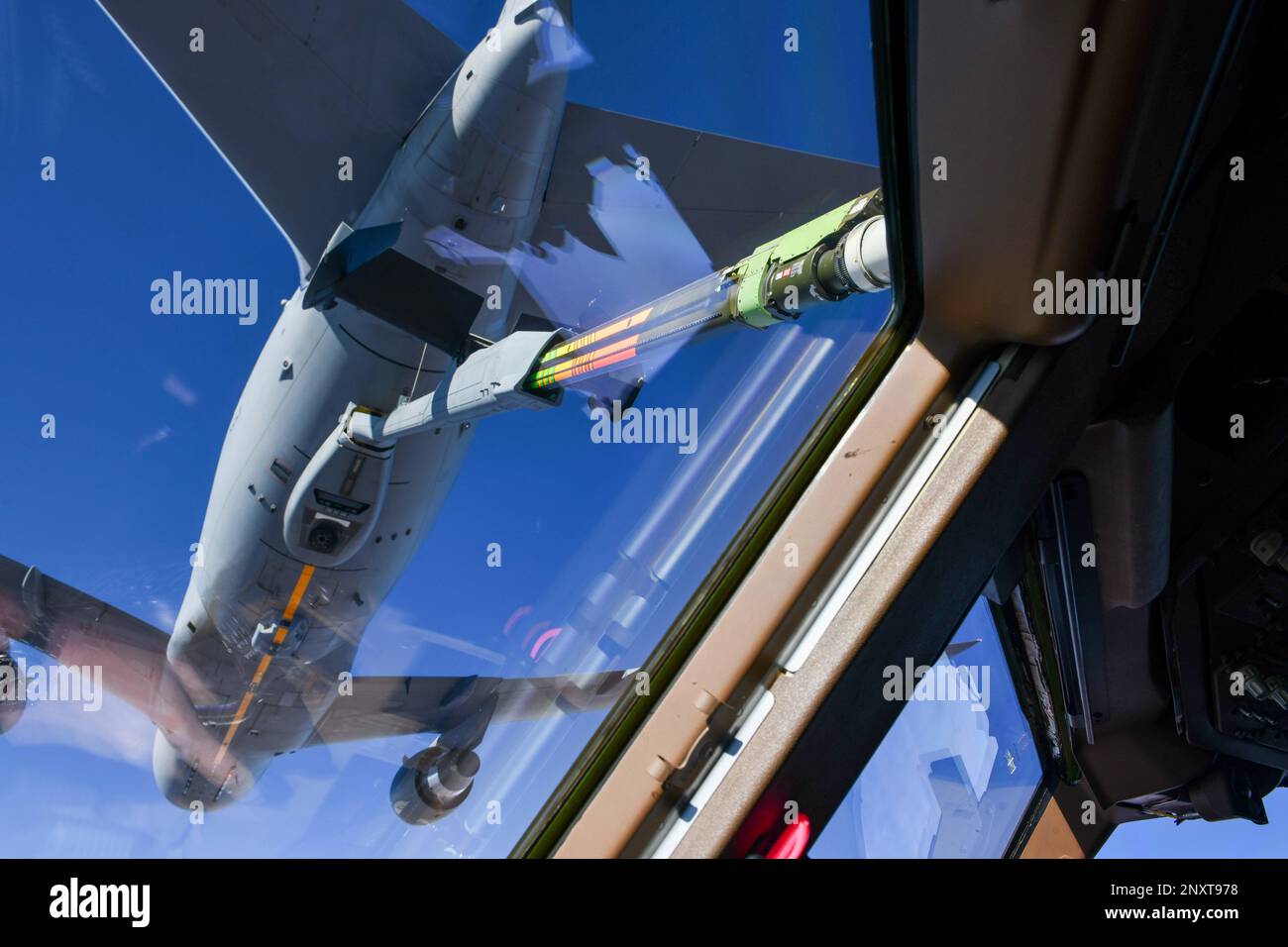 A KC-46 Pegasus from Altus Air Force Base (AFB), Oklahoma, refuels another KC-46 while en route to Travis AFB, Calif., Jan. 20, 2023. The KC-46 Pegasus is equipped with a refueling boom driven by a fly-by-wire control system. Stock Photo