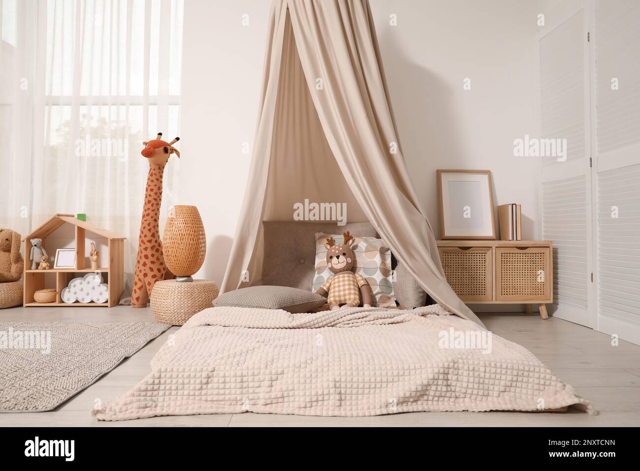 Cozy kids room with play tent, toys and comfortable floor bed ...