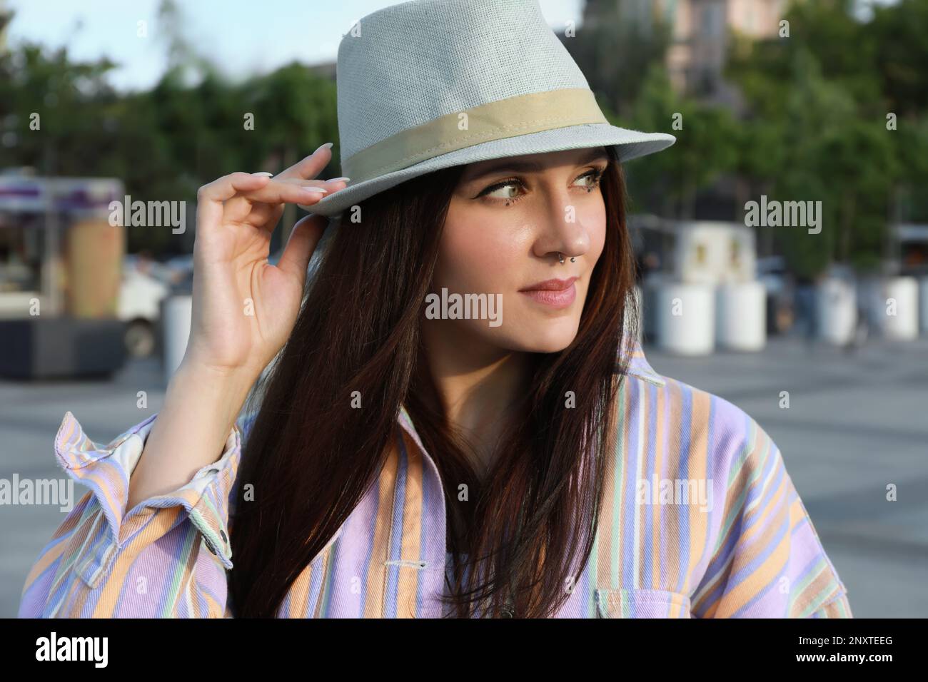Beautiful young woman with nose piercing