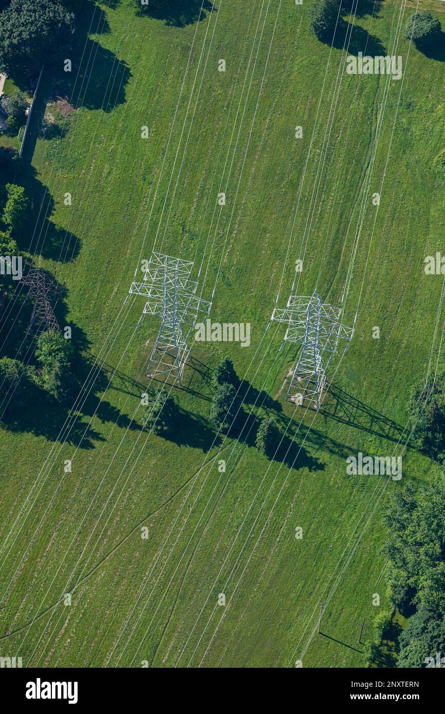 A stock image aerial view of power transmission lines and towers from