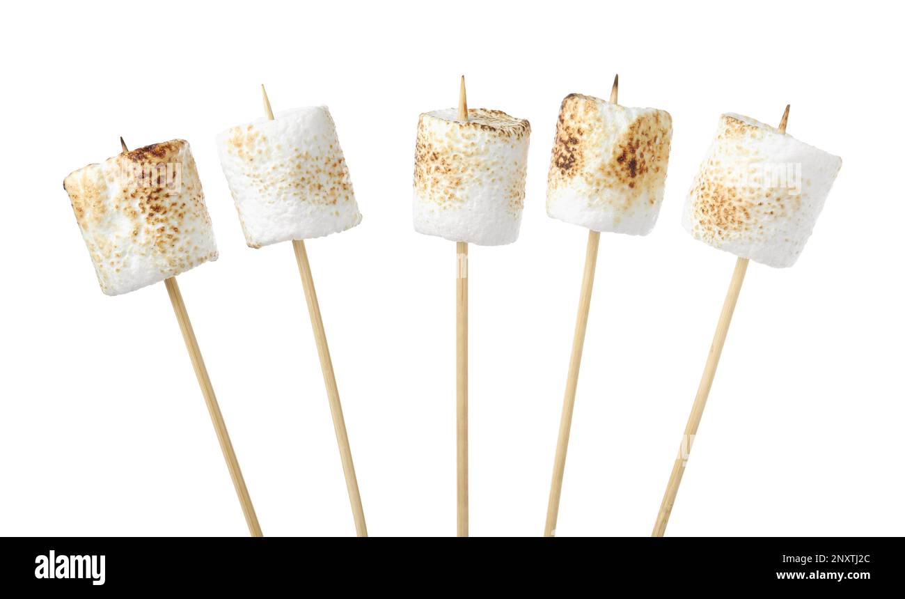 Sticks with roasted marshmallows on white background Stock Photo Alamy