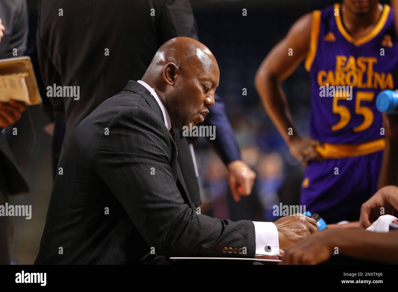 TULSA, OK - DECEMBER 28:East Carolina Pirates Head Coach Michael Perry  draws up play during a timeout during a college basketball game between the  Tulsa Golden Hurricane and the East Carolina Pirates