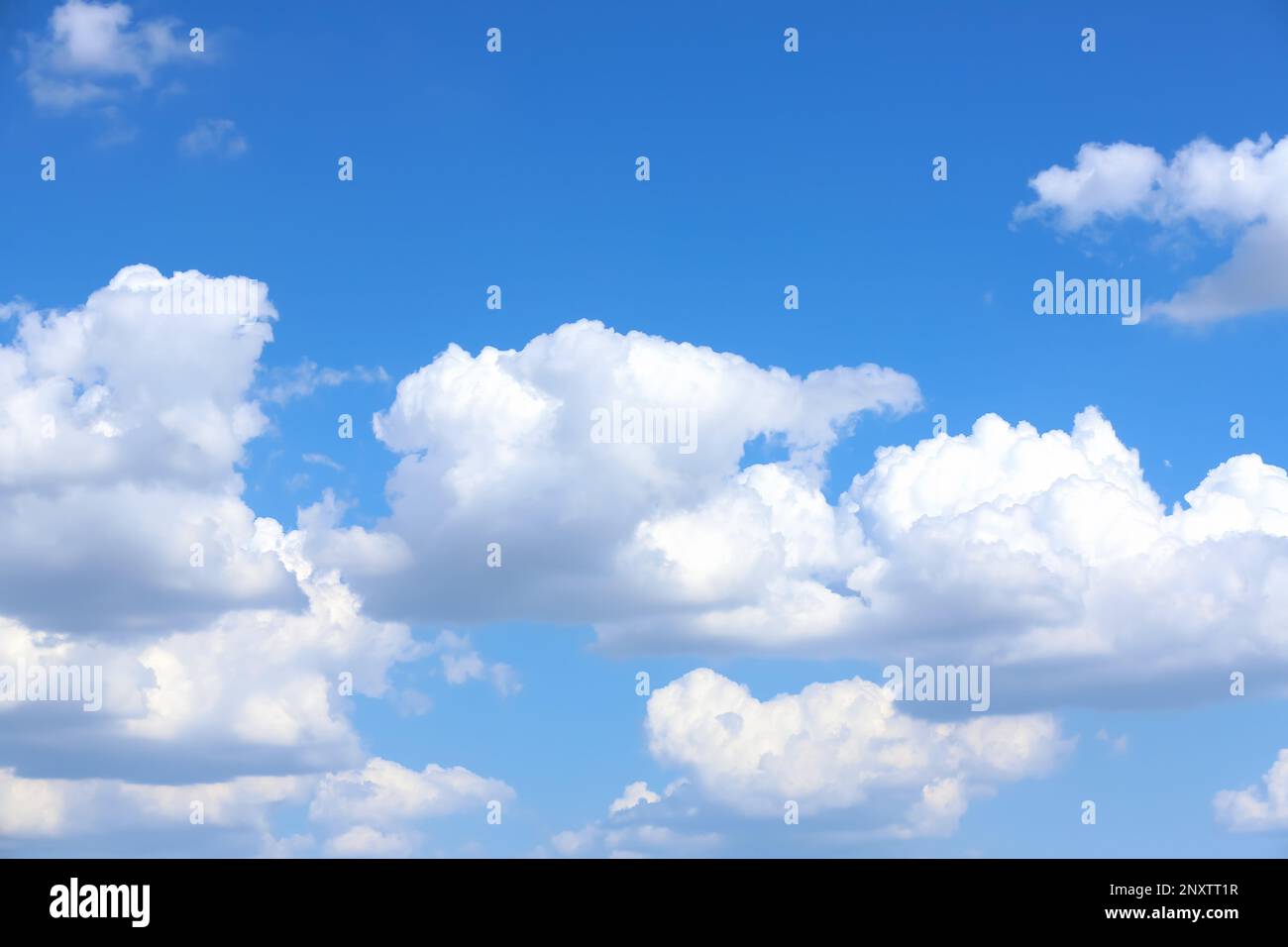 Beautiful white fluffy clouds in blue sky Stock Photo - Alamy