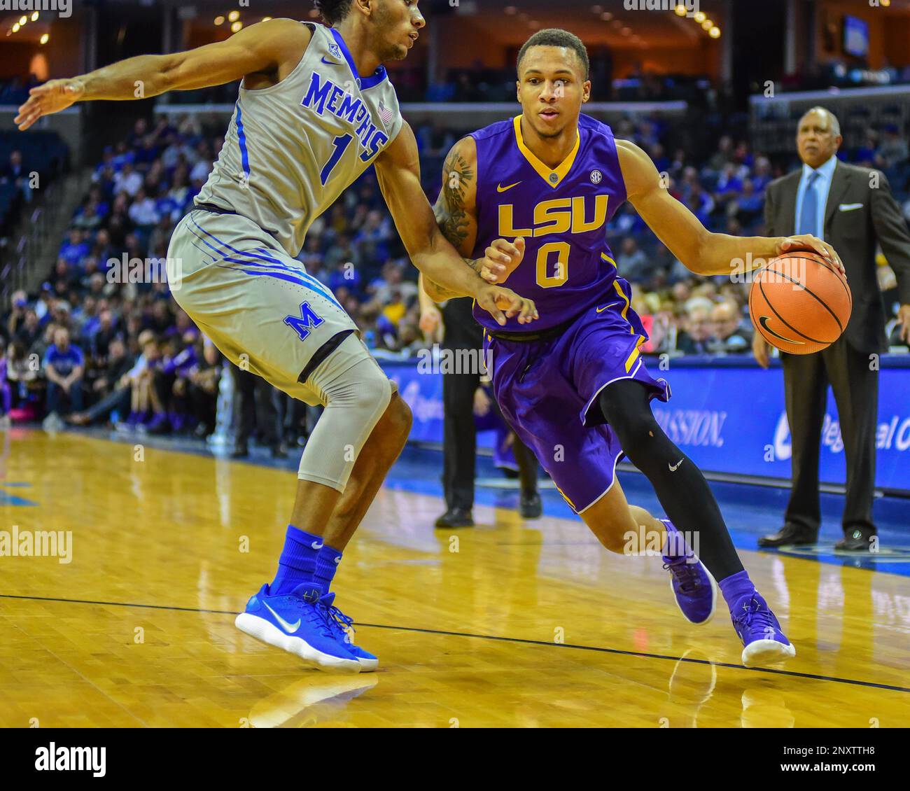 December 28, 2017; Memphis, TN, USA; LSU guard, BRANDON SAMPSON (0),  attempts to drive to the hoop, as Memphis, JAMAL JOHNSON (1), stands in the  way, during NCAA D1 basketball action at