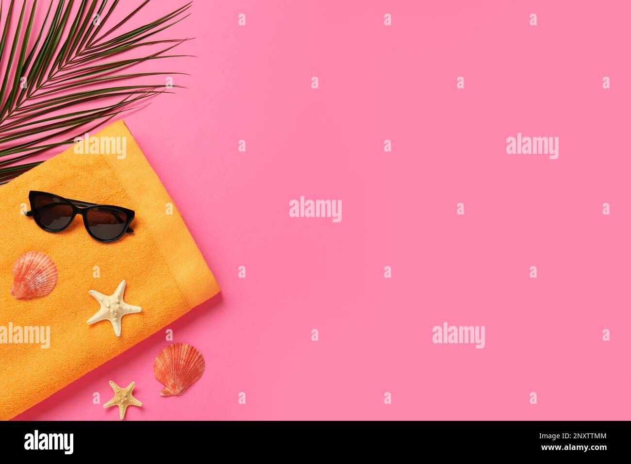 Flat lay composition with different beach objects on pink background, space for text Stock Photo