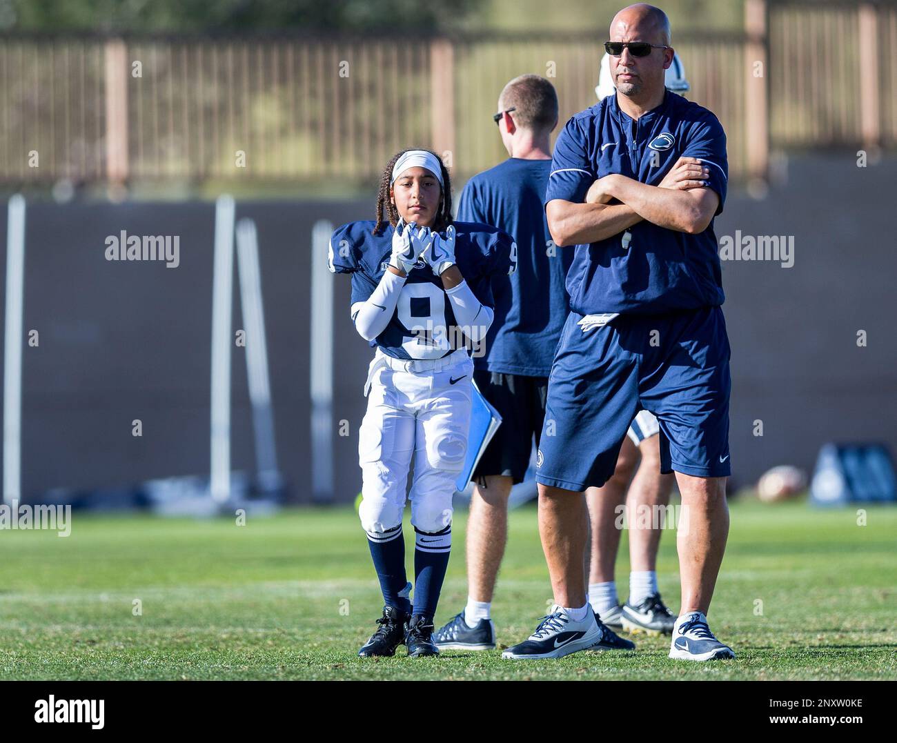 Penn State coach James Franklin and his daughter Shola, left, watch