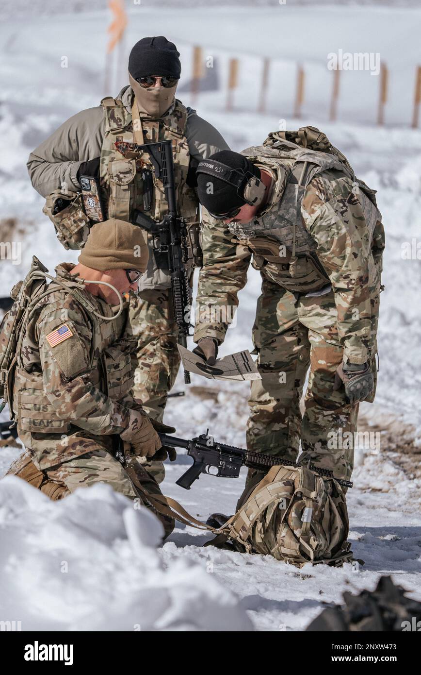 U.S. Service Members assigned to the 19th Special Forces Group (Airborne),  Utah Army National Guard, review their target while trying to sight in  their M4 on January 20, 2023 near Camp Williams,