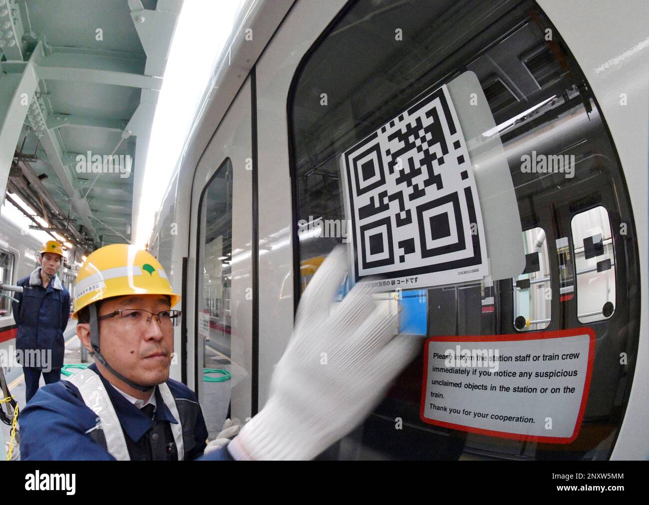 This photo shows a QR code sticker on a subway train that controls the ...