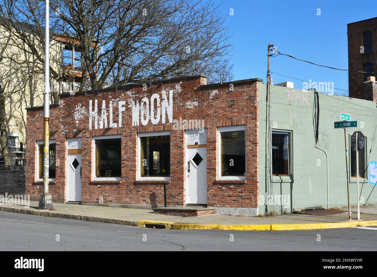 HUDSON, NEW YORK - 24 FEB 2023: The Half Moon Bar on Front Street has Beer on tap, classic cocktails and food served in a retro chic tavern with live Stock Photo