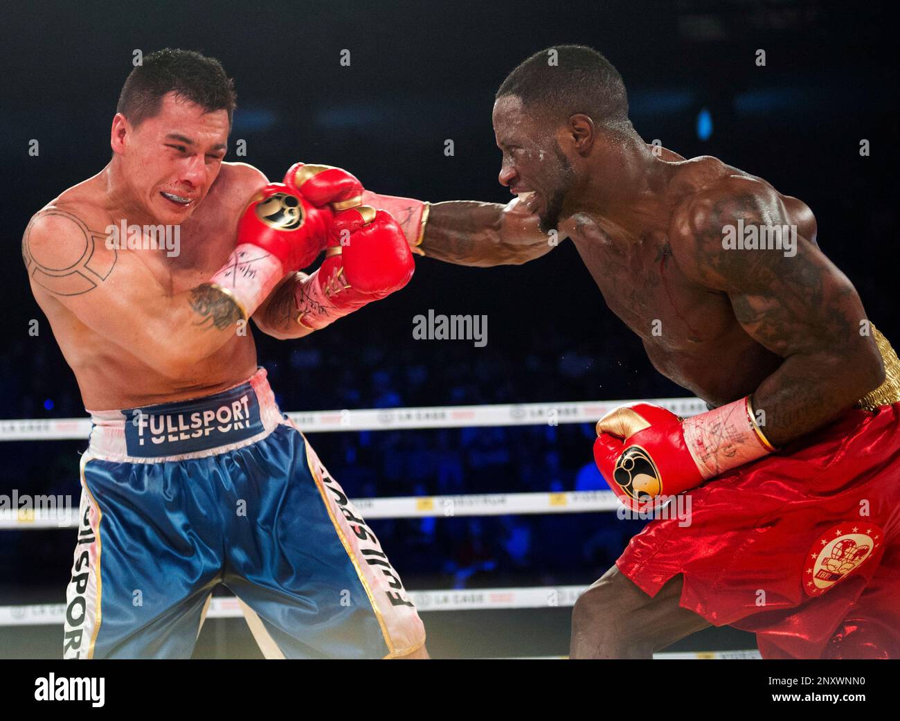 Custio Clayton, right, of Montreal, lands a right to the head of ...