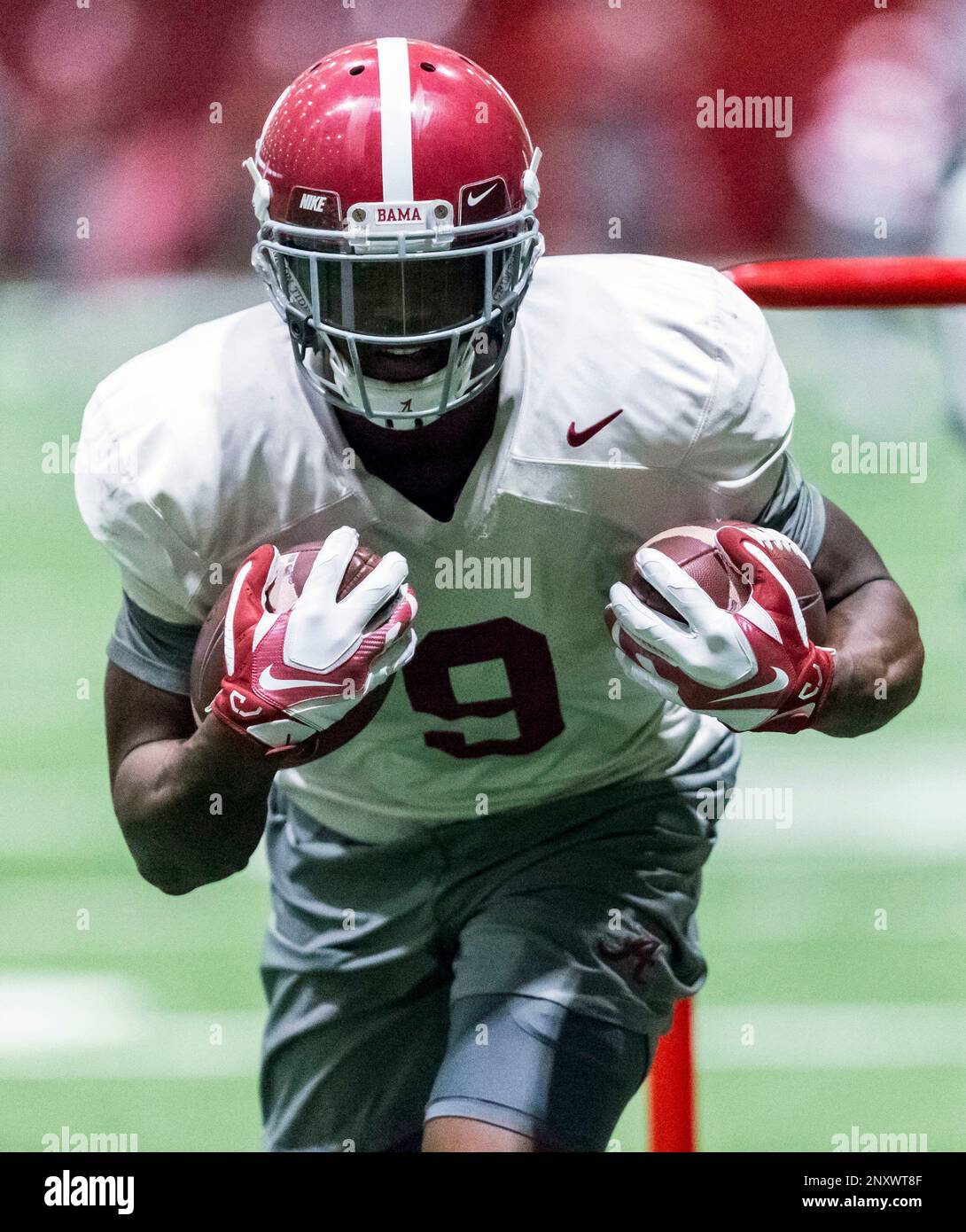 Alabama running back Bo Scarbrough (9) works through drills during