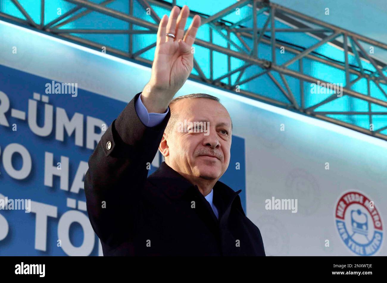 Turkey's President Recep Tayyip Erdogan waves to supporters during a ...