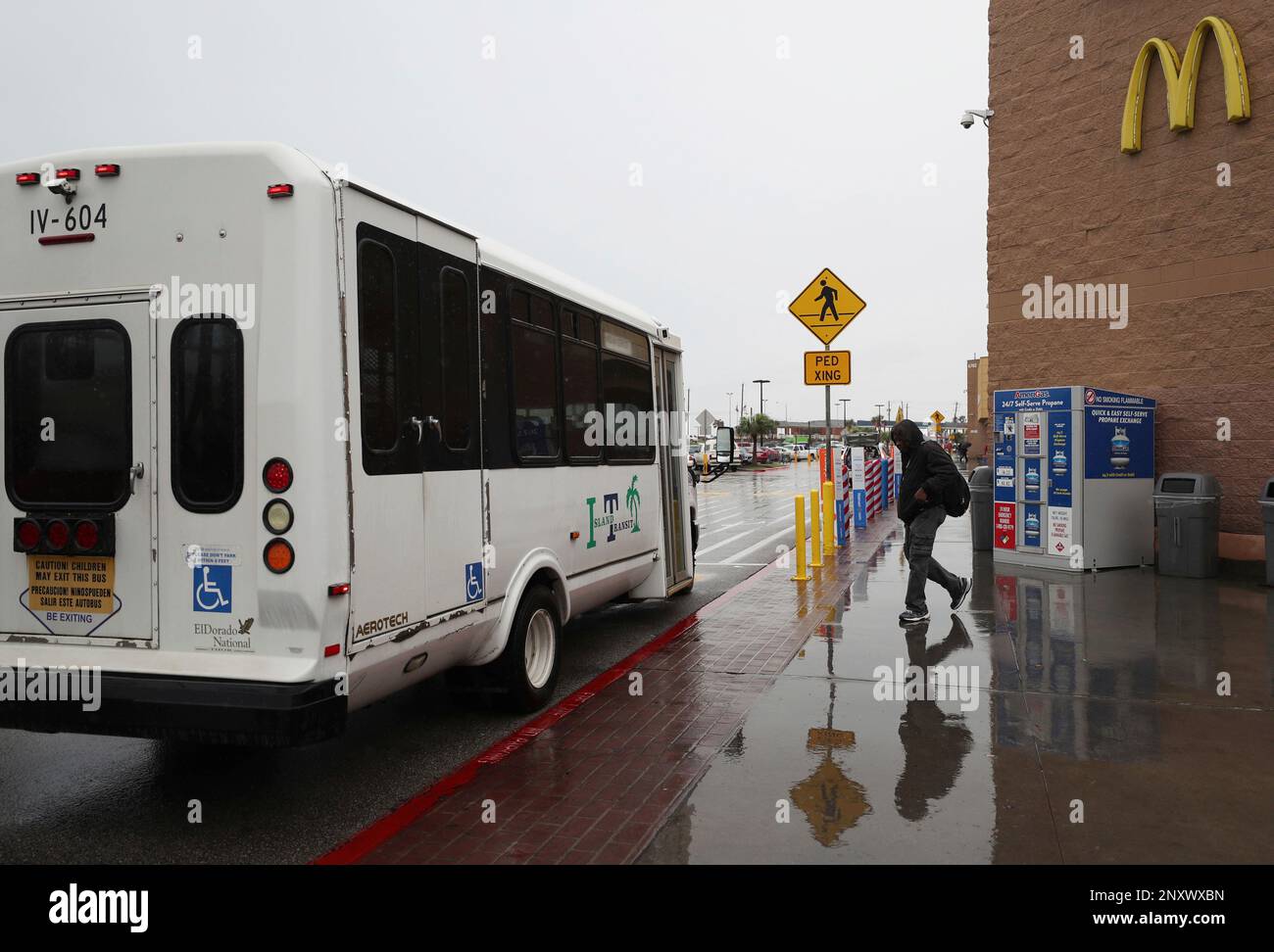In a Wednesday, Dec. 6, 2017 photo, a man walks toward an Island