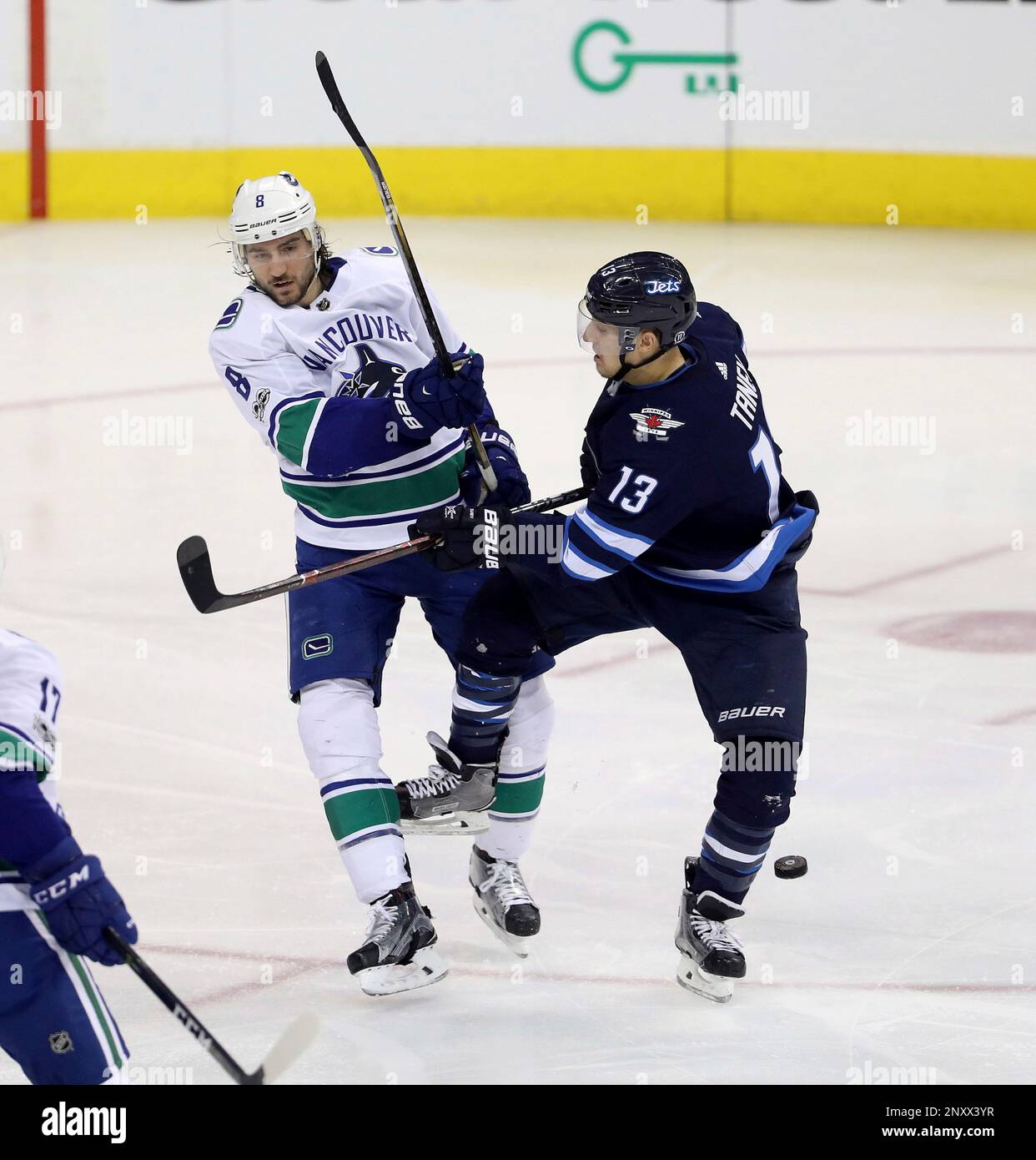 Vancouver Canucks' Christopher Tanev (8) and his brother, Winnipeg Jets