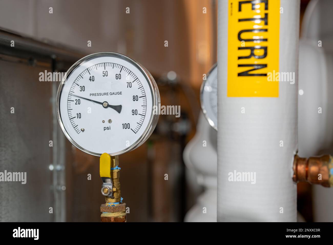 Closeup image of a hot water pressure gauge Stock Photo - Alamy