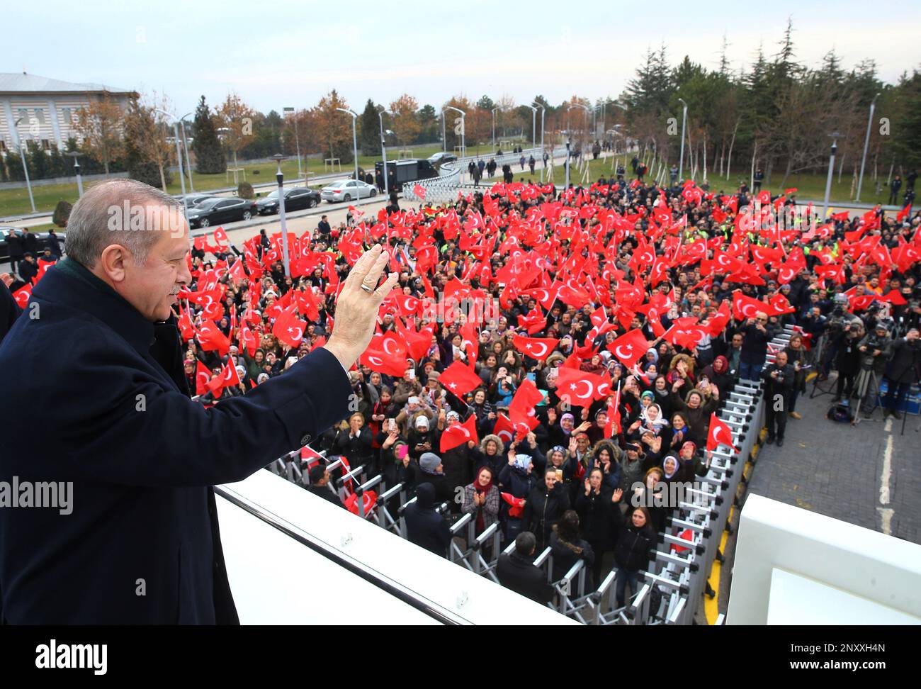 Turkey's President Recep Tayyip Erdogan waves to a group of workers at ...