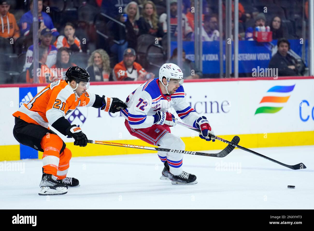 New York Rangers' Filip Chytil (72) Tries To Keep The Puck Away From ...