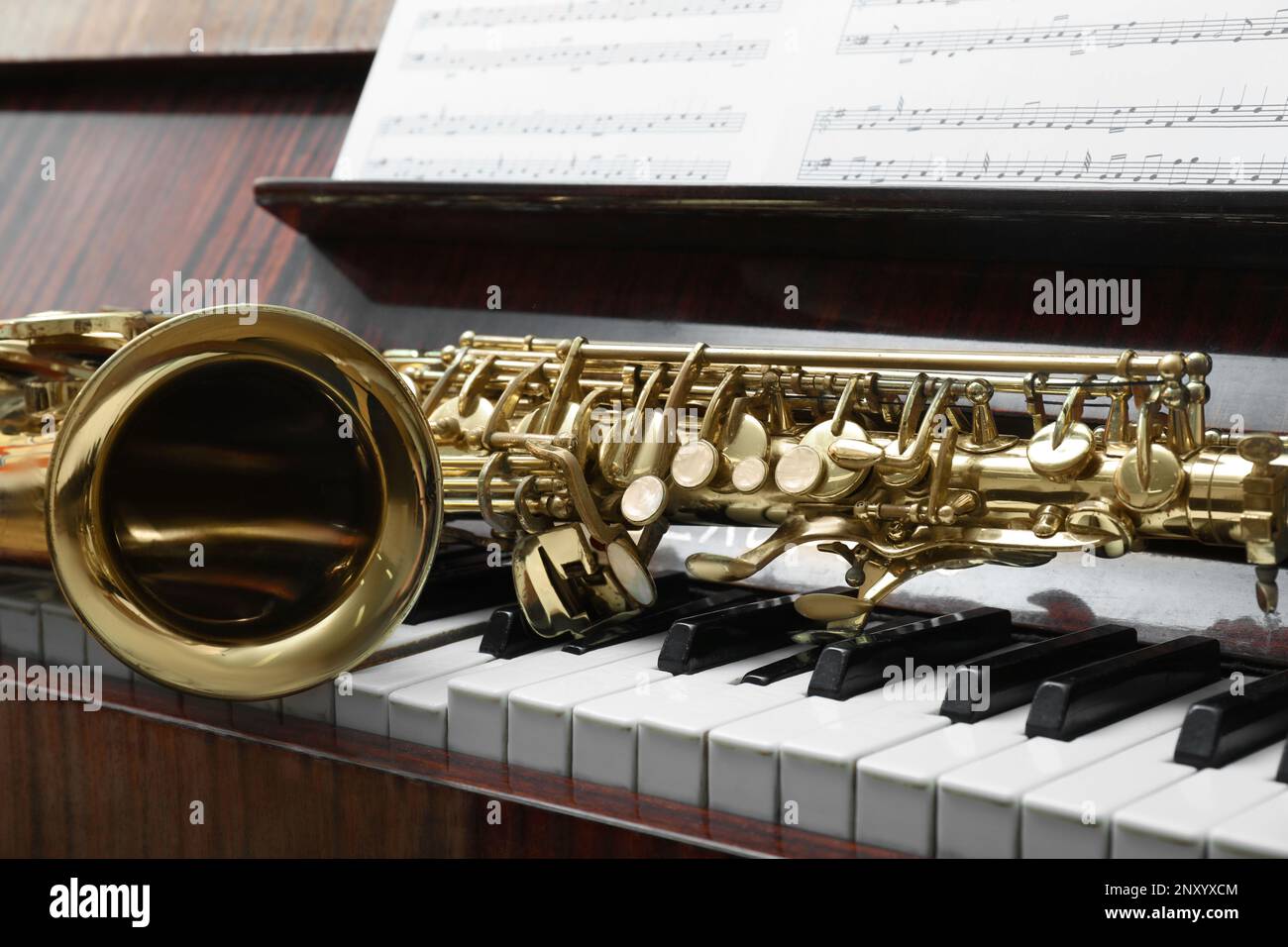 Beautiful saxophone on piano keys. Musical instruments Stock Photo Alamy