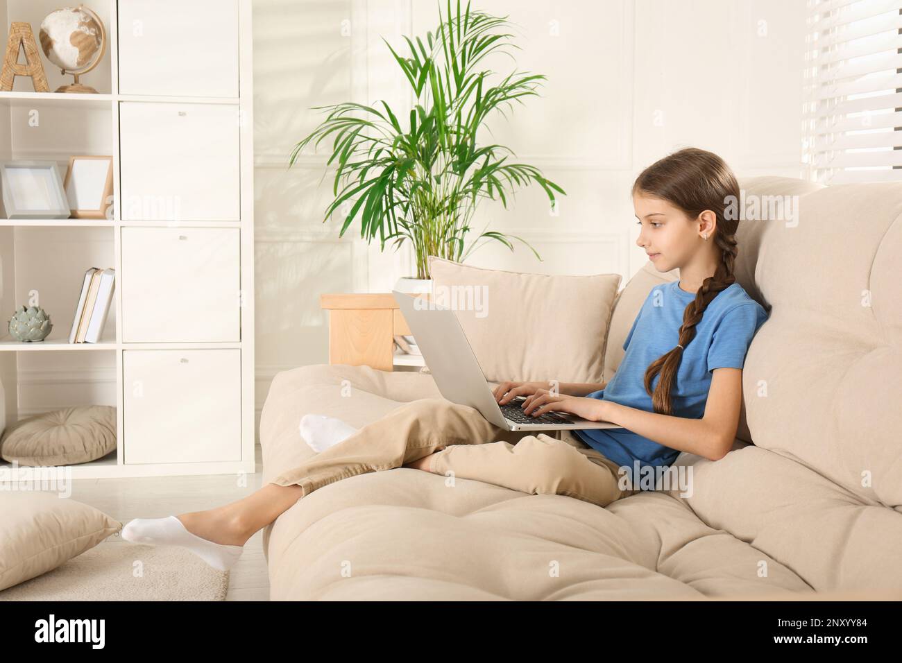 Tween girl laptop hi-res stock photography and images - Alamy
