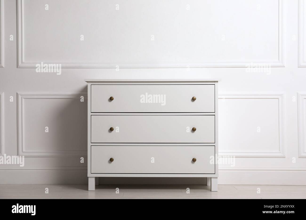 Stylish Chest Of Drawers Near White Wall Indoors Stock Photo Alamy stylish-chest-of-drawers-near-white-wall-indoors-stock-photo-alamy