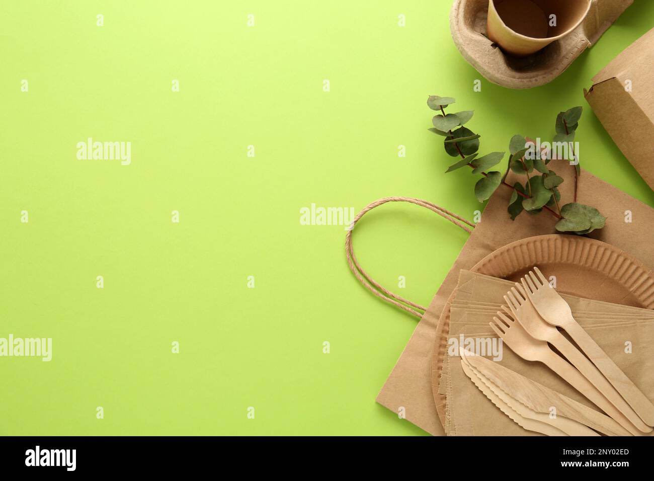 Flat lay composition with eco friendly products on light green ...