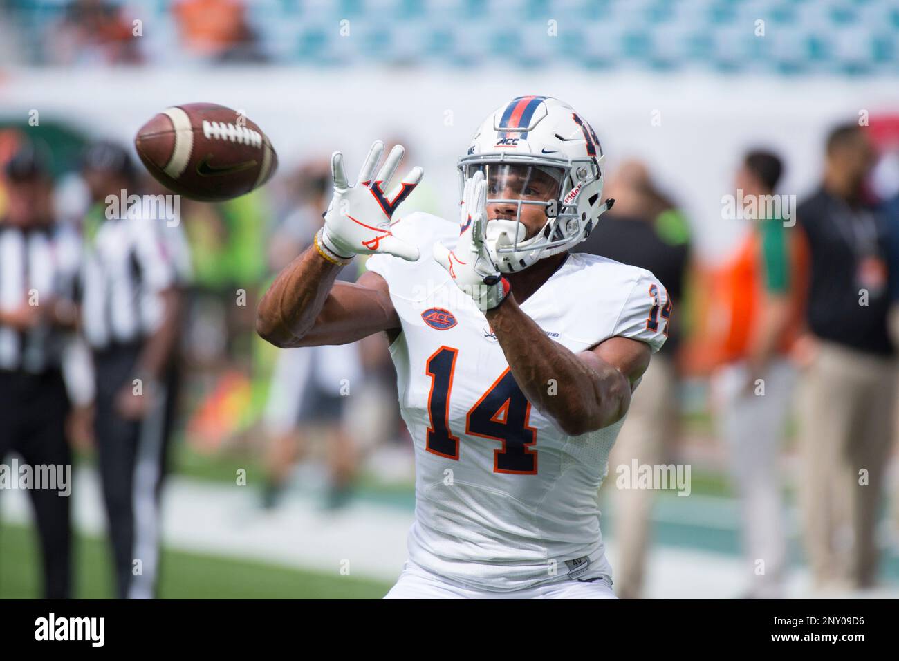 MIAMI GARDENS, FL - NOVEMBER 18: Virginia Cavaliers Wide Receiver Andre  Levrone (14) catches a ball on the field before the start of the college  football game between the Virginia Cavaliers and