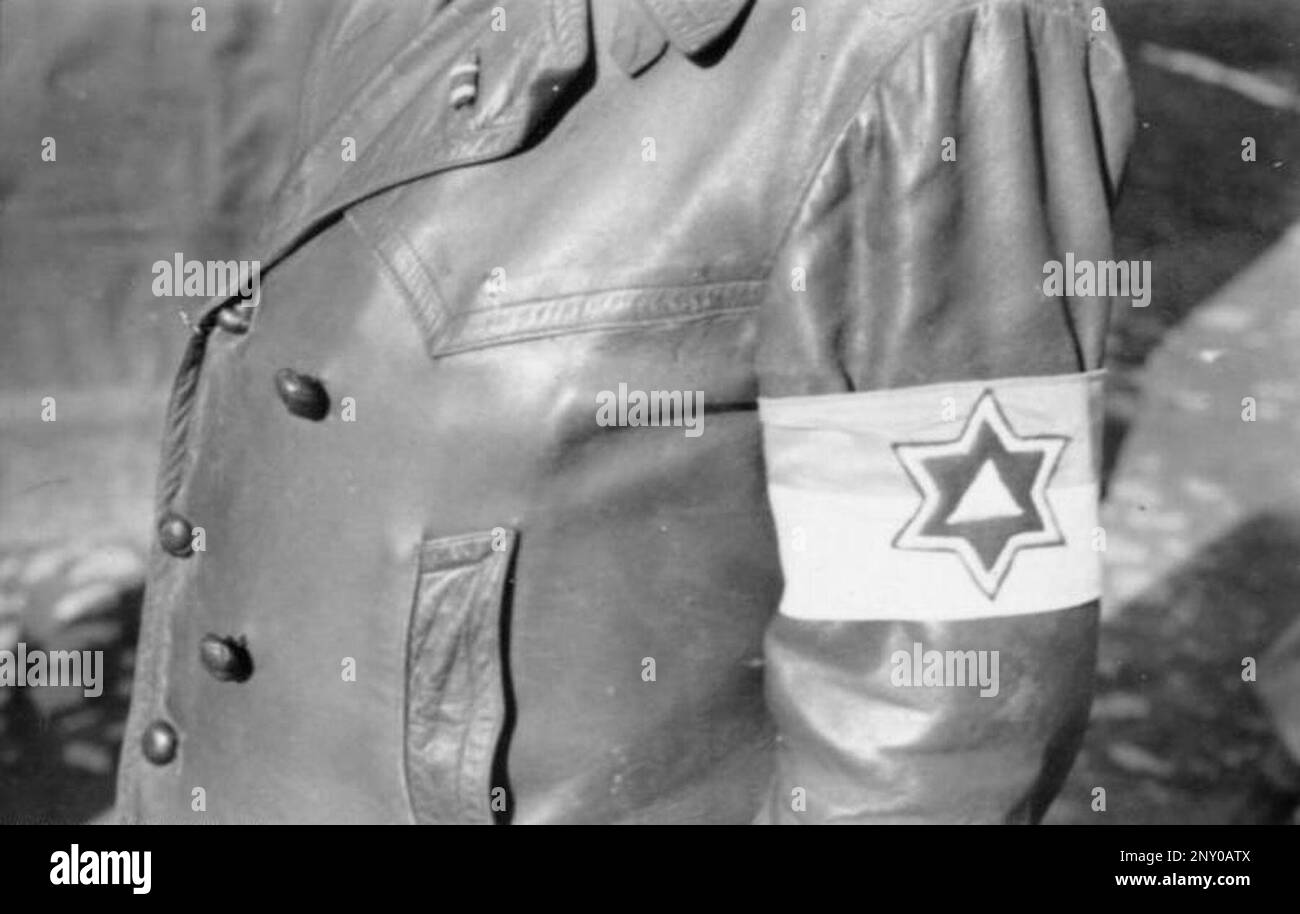 In the early stages of WW2 the Jews in nazi occupied europe were rounded up and forced into crowded ghettoes. When the decision was made to kill them all they were deported to extermination centres to be murdered. This image shows a jewish order police armband in the Lodz Ghetto. Stock Photo