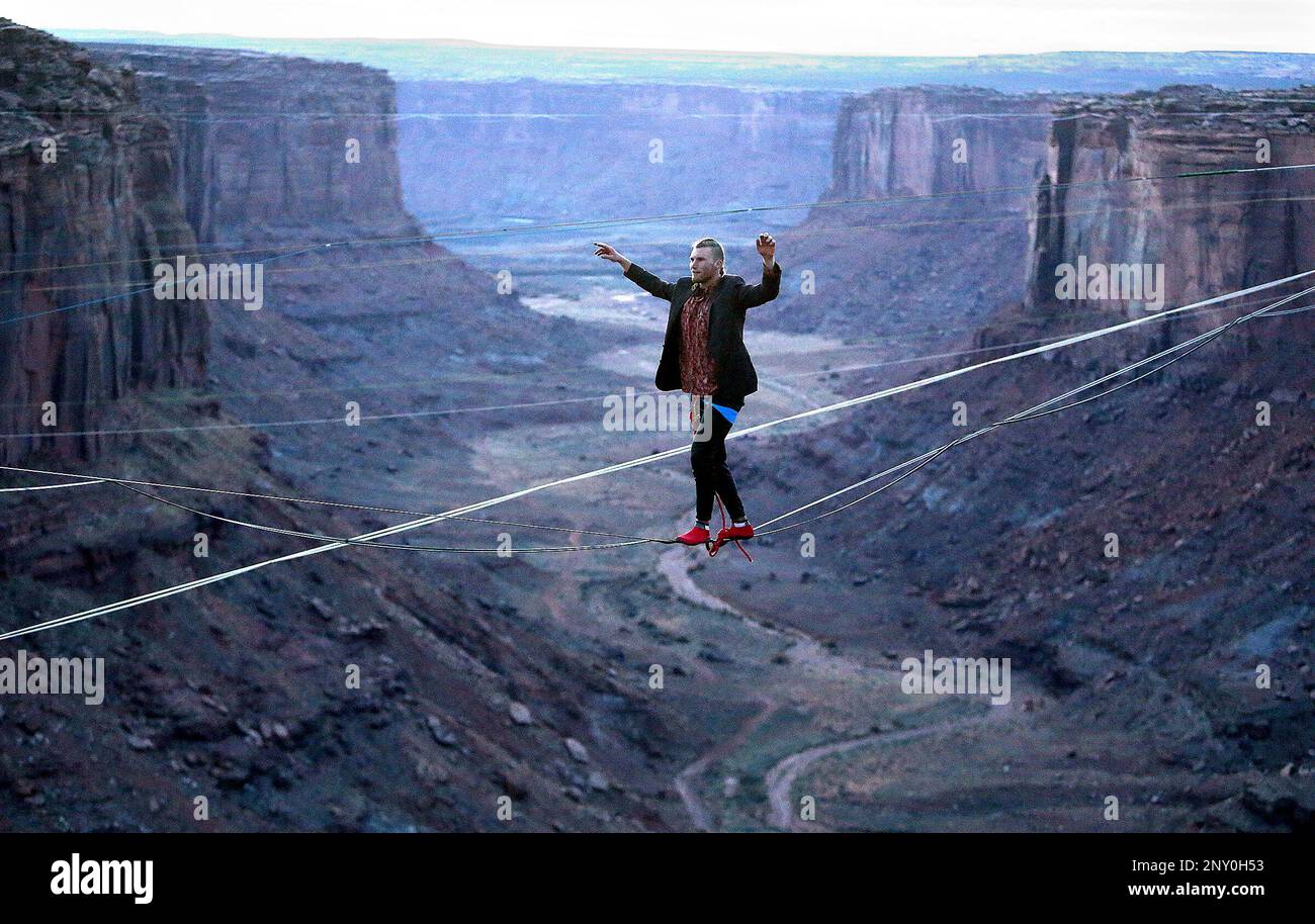 In this Monday, Nov. 20, 2017 photo, R.J. Roush slacklines across the Fruit Bowl, near